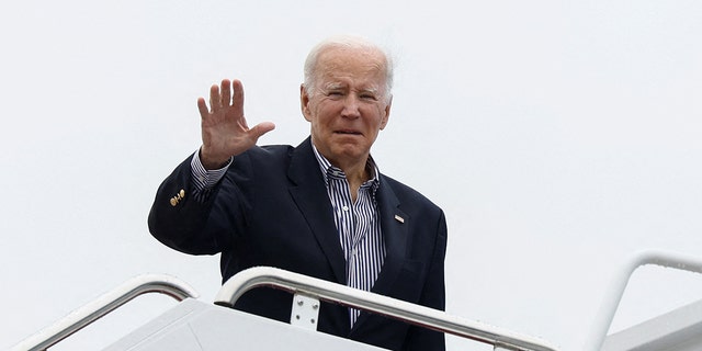 President Biden waves as he boards Air Force One as it leaves Joint Base Andrews, Maryland, for Florida on October 5, 2022.