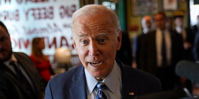 FILE - President Biden speaks with members of the media after picking up a meal at Primanti Bros. restaurant, Thursday, Oct. 20, 2022, in Moon Township, Pennsylvania.