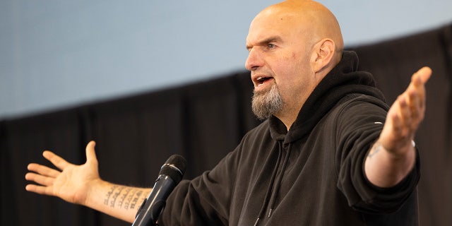 Pennsylvania Lt. Gov. John Fetterman, Democratic candidate for U.S. Senate, accompanied by Rep. Dwight Evans, D-Pa., speaks in Philadelphia, Saturday, Sept. 24, 2022.