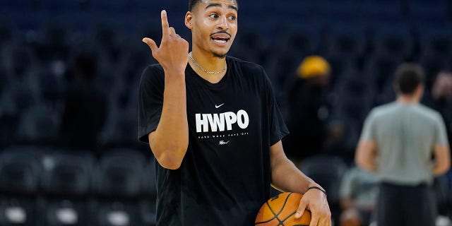 Golden State Warriors guard Jordan Poole warms up before a preseason game against the Denver Nuggets in San Francisco on Oct. 14, 2022.
