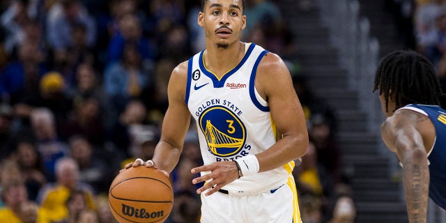 Golden State's Jordan Poole looks to pass against the Denver Nuggets at Chase Center in San Francisco on Oct. 14, 2022.