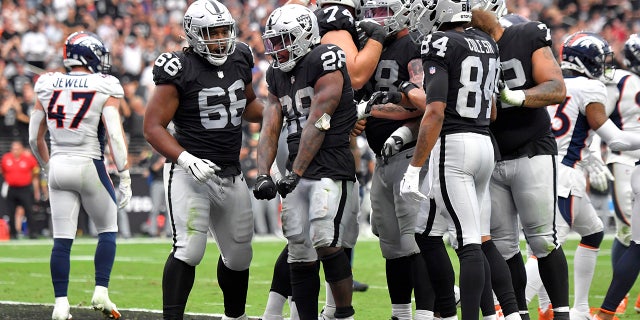 Las Vegas Raiders running back Josh Jacobs (28) celebrates his touchdown run against the Denver Broncos during the first half of an NFL football game, Sunday, Oct. 2, 2022, in Las Vegas.