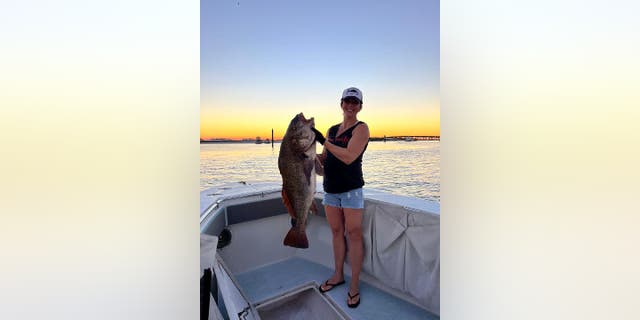 Julie Augustine caught her potential world record black drum in Destin, Florida, while freediving with a polespear.