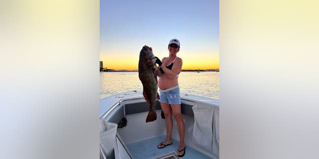 Julie Augustine's potential world record black drum was caught on Oct. 1, 2022. She was eight months pregnant at the time. 