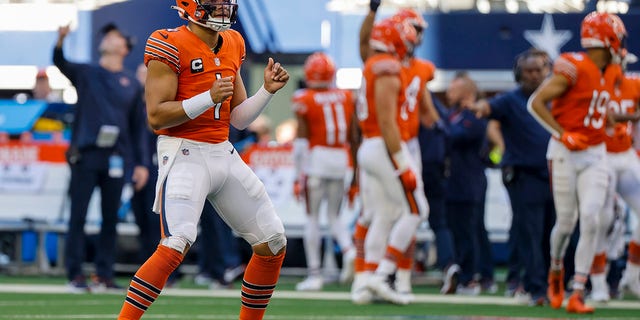 Chicago Bears' Justin Fields celebrates a touchdown against the Dallas Cowboys Sunday, Oct. 30, 2022, in Arlington, Texas.