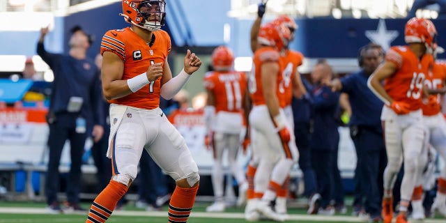 Chicago Bears' Justin Fields celebrates a touchdown against the Dallas Cowboys Sunday, Oct. 30, 2022, in Arlington, Texas.