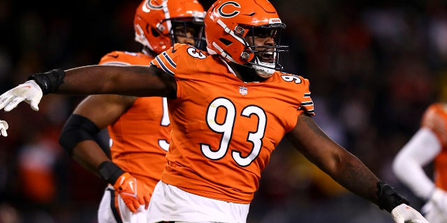 Justin Jones of the Bears celebrates after a missed field goal during the Washington Commanders game at Soldier Field on Oct. 13, 2022, in Chicago.