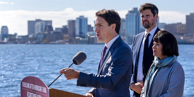Canadian Prime Minister Justin Trudeau accompanied by Ginette Petitpas Taylor, right, minister responsible for the Atlantic Canada Opportunities Agency, and Sean Fraser, immigration minister, announces support for victims of post-tropical storm Fiona in Dartmouth, Nova Scotia, on Tuesday, Oct. 4, 2022.