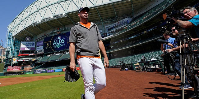 Houston Astros starting pitcher Justin Verlander walks toward the dugout after a workout ahead of Game 1 of baseball's American League Division Series, Monday, Oct. 10, 2022, in Houston. The Astros will play the Seattle Mariners Tuesday.