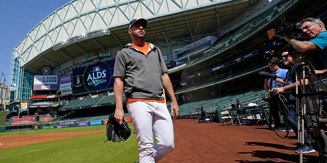 Houston Astros starting pitcher Justin Verlander walks toward the dugout after a workout ahead of Game 1 of baseball's American League Division Series, Monday, Oct. 10, 2022, in Houston. The Astros will play the Seattle Mariners Tuesday.