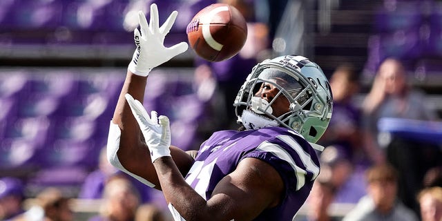 Kansas State running back DJ Giddens catches a pass during warmups before an NCAA college football game against Oklahoma State Saturday, Oct. 29, 2022, in Manhattan, Kan.