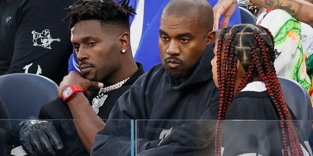 Antonio Brown, Ye West and North West attend Super Bowl LVI between the Los Angeles Rams and the Cincinnati Bengals at SoFi Stadium on February 13, 2022 in Inglewood, California.
