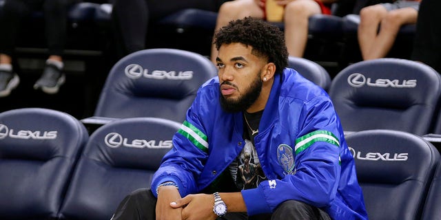 Minnesota Timberwolves forward Karl-Anthony Towns watches from the seats during the NBA basketball team's open practice Saturday, Oct. 1, 2022, in Minneapolis.