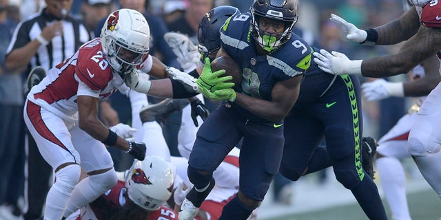 Seattle Seahawks running back Kenneth Walker III (9) runs against the Arizona Cardinals during the second half of an NFL football game in Seattle, Sunday, Oct. 16, 2022. 