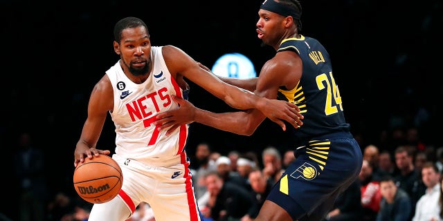 Brooklyn Nets forward Kevin Durant drives to the basket against Indiana Pacers guard Buddy Hield, Saturday, Oct. 29, 2022, in New York.