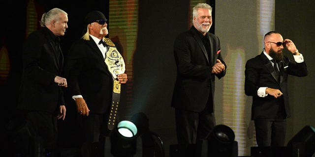 2020 WWE Hall of Fame inductees Scott Hall and Hollywood Hulk Hogan and Kevin Nash and Sean Waltman, aka NWO, greet fans during WrestleMania 37 at Raymond James Stadium in Tampa, Florida, April 10, 2021.