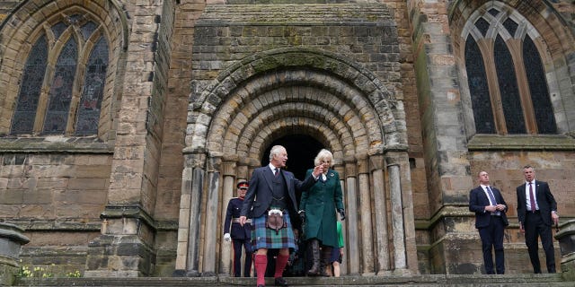 King Charles III and Camilla, queen consort, leave Dunfermline Abbey after attending a meeting at the City Chambers in Dunfermline where the King formally marked the conferral of city status on the former town.