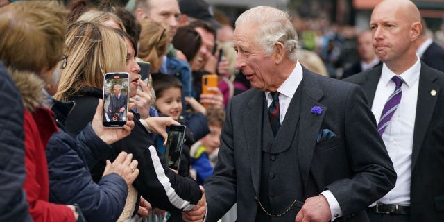 King Charles III greets members of the public after an official council meeting at the City Chambers in Dunfermline, Fife.