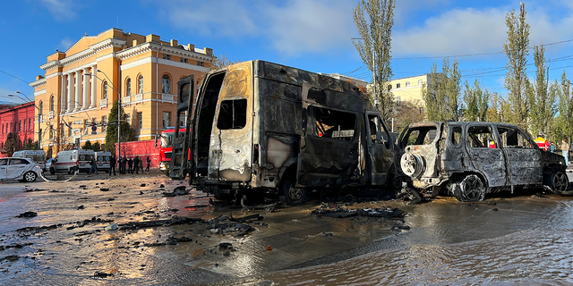 Cars are damaged as underground pipes leak at the scene of a Russian attack in Kiev, Ukraine on Monday, October 10, 2022. 