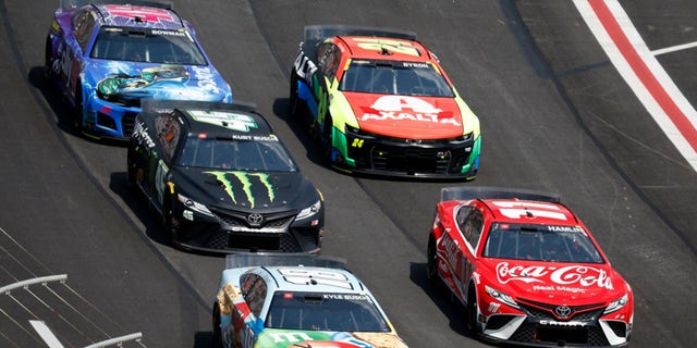 HAMPTON, GA - JULY 10: Denny Hamlin, driver #11 Coca-Cola Toyota, Kyle Busch, driver #18 M&M's Crunchy Cookie Toyota, Kurt Bosch, driver #45 Monster Energy Toyota, William Byron, driver #24 Chevrolet Axelta, Alex Bowman, race driver of the #48 Allie Milestone Chevrolet, during the NASCAR Cup Series Quaker State 400 race at Atlanta Motor Speedway on July 10, 2022, in Hampton, Georgia.