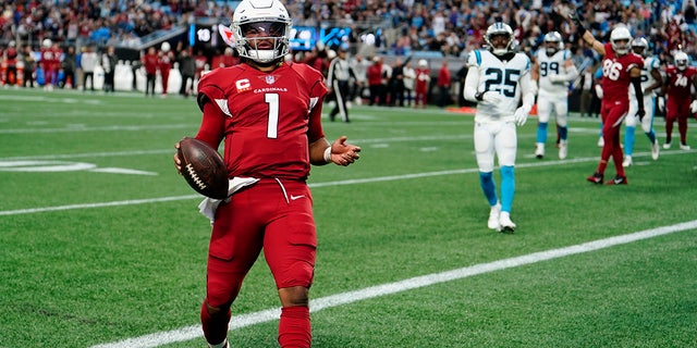 Arizona Cardinals quarterback Kyler Murray scores against the Carolina Panthers during the second half of an NFL football game on Sunday, Oct. 2, 2022, in Charlotte, N.C. 