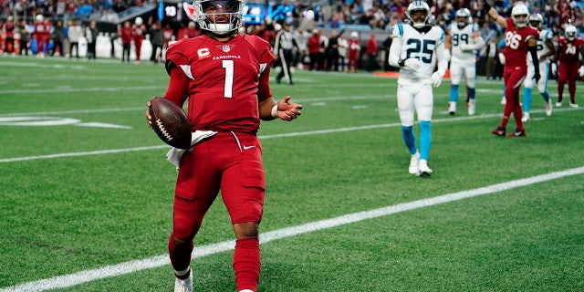 Arizona Cardinals quarterback Kyler Murray scores against the Carolina Panthers during the second half of an NFL football game on Sunday, Oct. 2, 2022, in Charlotte, N.C. 