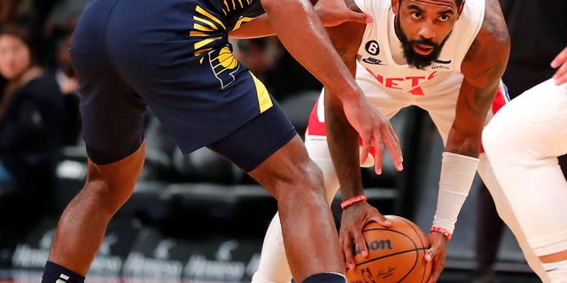 Brooklyn Nets guard Kyrie Irving looks for help against Indiana Pacers, Saturday, Oct. 29, 2022, in New York.