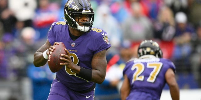 Baltimore Ravens quarterback Lamar Jackson looks for a receiver in the first half of an NFL football game against the Buffalo Bills Sunday, Oct. 2, 2022, in Baltimore. 