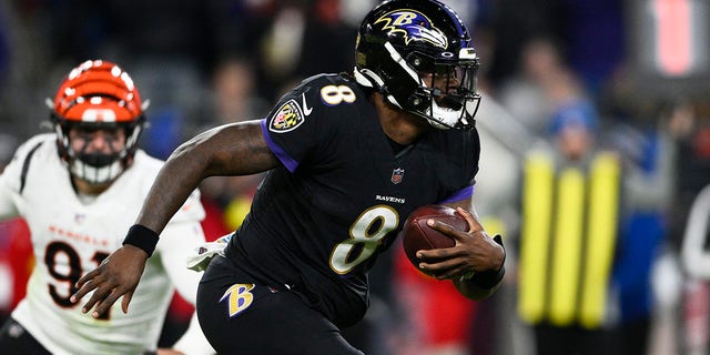 Baltimore Ravens quarterback Lamar Jackson carries the ball during the second half of an NFL football game against the Cincinnati Bengals, Sunday, Oct. 9, 2022, in Baltimore.