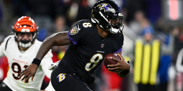 Baltimore Ravens quarterback Lamar Jackson carries the ball during the second half of an NFL football game against the Cincinnati Bengals, Sunday, Oct. 9, 2022, in Baltimore.