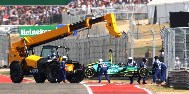 Aston Martin's Lance Stroll is towed away in Austin.