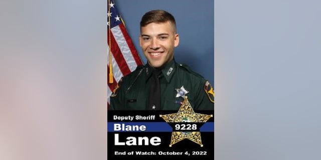 Polk County Deputy Sheriff Blane Lane was shot and killed by friendly fire while trying to arrest a suspect on an outstanding warrant, authorities said Tuesday.