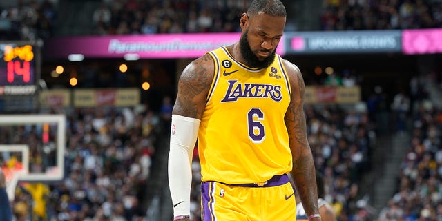 Los Angeles Lakers forward LeBron James heads to the bench in the second half of an NBA basketball game against the Denver Nuggets Wednesday, Oct. 26, 2022, in Denver. 