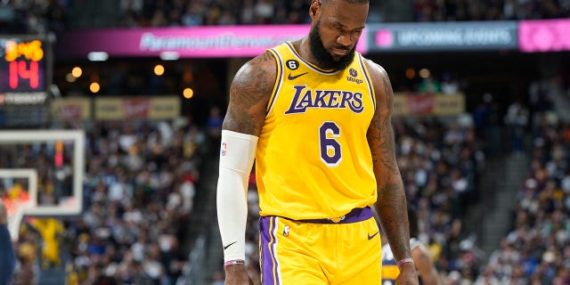 Los Angeles Lakers forward LeBron James heads to the bench in the second half of an NBA basketball game against the Denver Nuggets Wednesday, Oct. 26, 2022, in Denver. 