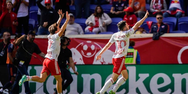 New York Red Bulls midfielder Lewis Morgan (10) celebrates his goal against the FC Cincinnati during the second half of an MLS soccer playoff game, Saturday, Oct. 15, 2022, in Harrison, N.J.