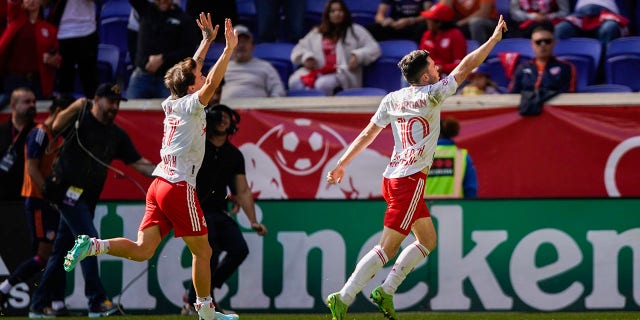 New York Red Bulls midfielder Lewis Morgan (10) celebrates his goal against the FC Cincinnati during the second half of an MLS soccer playoff game, Saturday, Oct. 15, 2022, in Harrison, N.J.