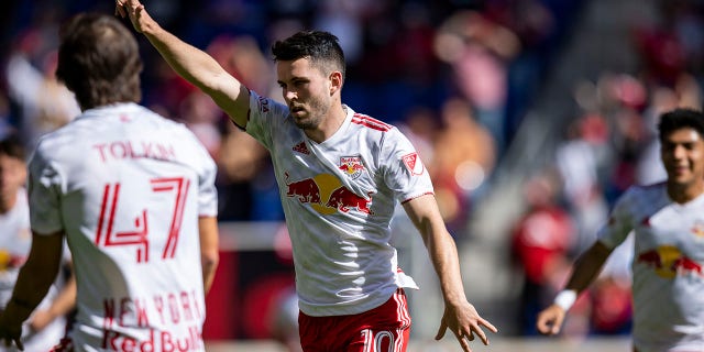 Lewis Morgan #10 of the New York Red Bulls scores a goal in the second half of the Eastern Conference Round 1 game against FC Cincinnati in the Audi 2022 MLS Cup Playoffs at Red Bull Arena on October 15, 2022 in Harrison, New Jersey. celebrate.