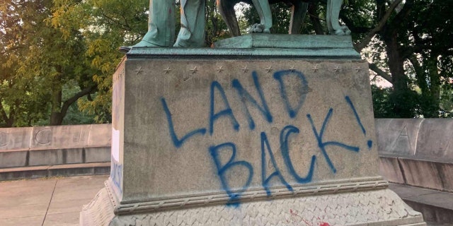 Vandals also spray-painted graffiti on the base that said, "Dethrone the Colonizers," "Land Back!" and "Avenge the Dakota 38."