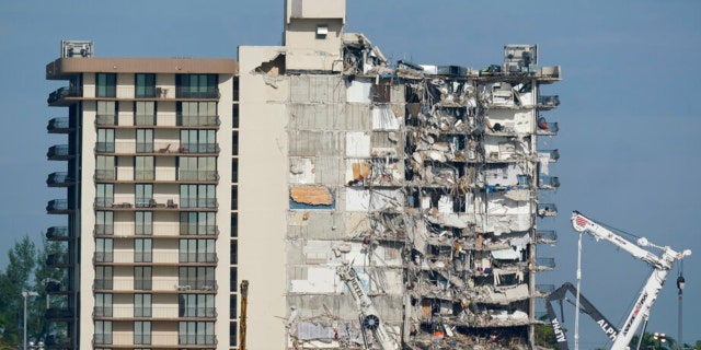 Coast Guard boats patrol in front of the partially collapsed Champlain Towers South condo building in Surfside, Florida, on July 1, 2021.