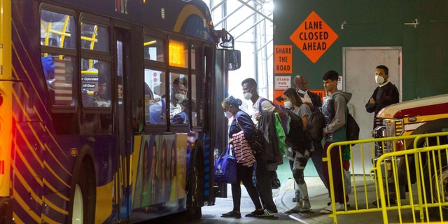 Migrants leave for a shelter from the Port Authority Bus Terminal in New York, on Sept. 27, 2022.