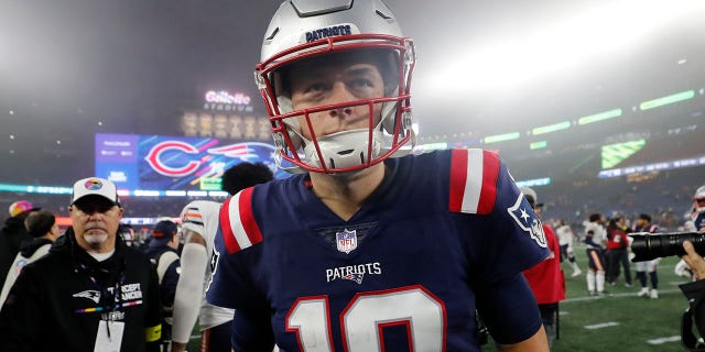 New England Patriots quarterback Mac Jones walks off the field after a 33-14 loss to the Chicago Bears after an NFL football game, Monday, Oct. 24, 2022, in Foxborough, Mass.