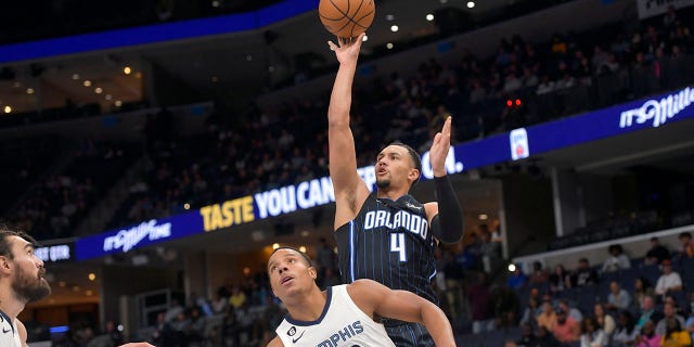 Orlando Magic guard Jalen Suggs shoots against the Memphis Grizzlies on Oct. 3, 2022, in Memphis.