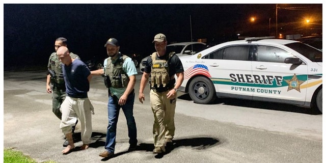 Officers with the Putnam County Sheriff's Office arrest Mark Wilson on Aug. 27, 2020, days after he brutally murdered two boys with a filet knife.