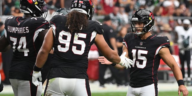 Matt Ammendola of the Cardinals celebrates with teammates after an extra point during the Philadelphia Eagles game at State Farm Stadium on Oct. 9, 2022, in Glendale, Arizona.