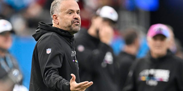 Carolina Panthers head coach Matt Rhule speaks to officials during the second quarter of a game against the San Francisco 49ers at Bank of America Stadium on October 9, 2022 in Charlotte, North Carolina.