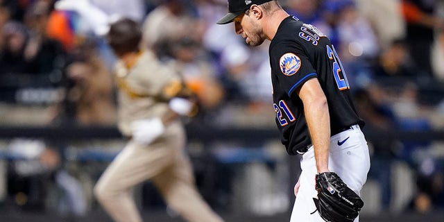 New York Mets starting pitcher Max Scherzer, #21, reacts after giving up a home run to the San Diego Padres during the fifth inning of Game 1 of a National League wild-card baseball playoff series, Friday, Oct. 7, 2022, in New York. 