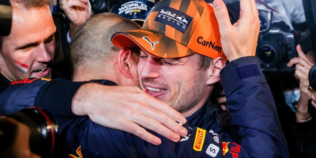 Max Verstappen celebrates with his race engineer Gianpiero Lambiase at Suzuka International Racing Course on Oct. 9, 2022, in Japan.