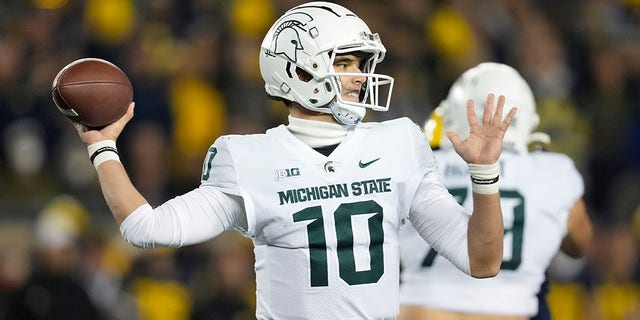 Michigan state quarterback Payton Thorne (10) pitches against Michigan in the first half of an NCAA college football game in Ann Arbor, Michigan on Saturday, Oct. 29, 2022.