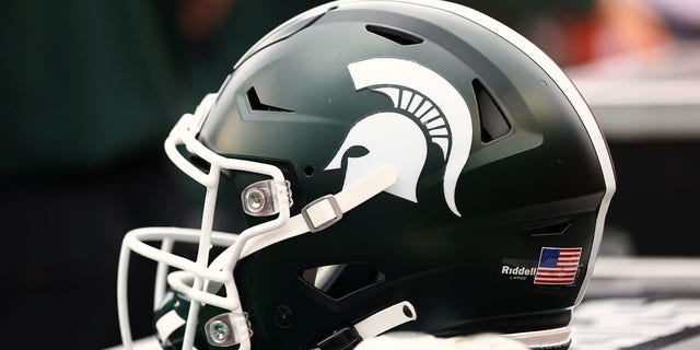 A Michigan State Spartans helmet sits on the sidelines during a game against the Rutgers Scarlet Knights at SHI Stadium on October 9, 2021 in Piscataway, New Jersey.