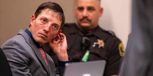 Ex-Grand Rapids police officer Christopher Schurr appears for the second day of his preliminary examination at the Kent County Courthouse in Grand Rapids, Michigan, on Oct. 28, 2022.